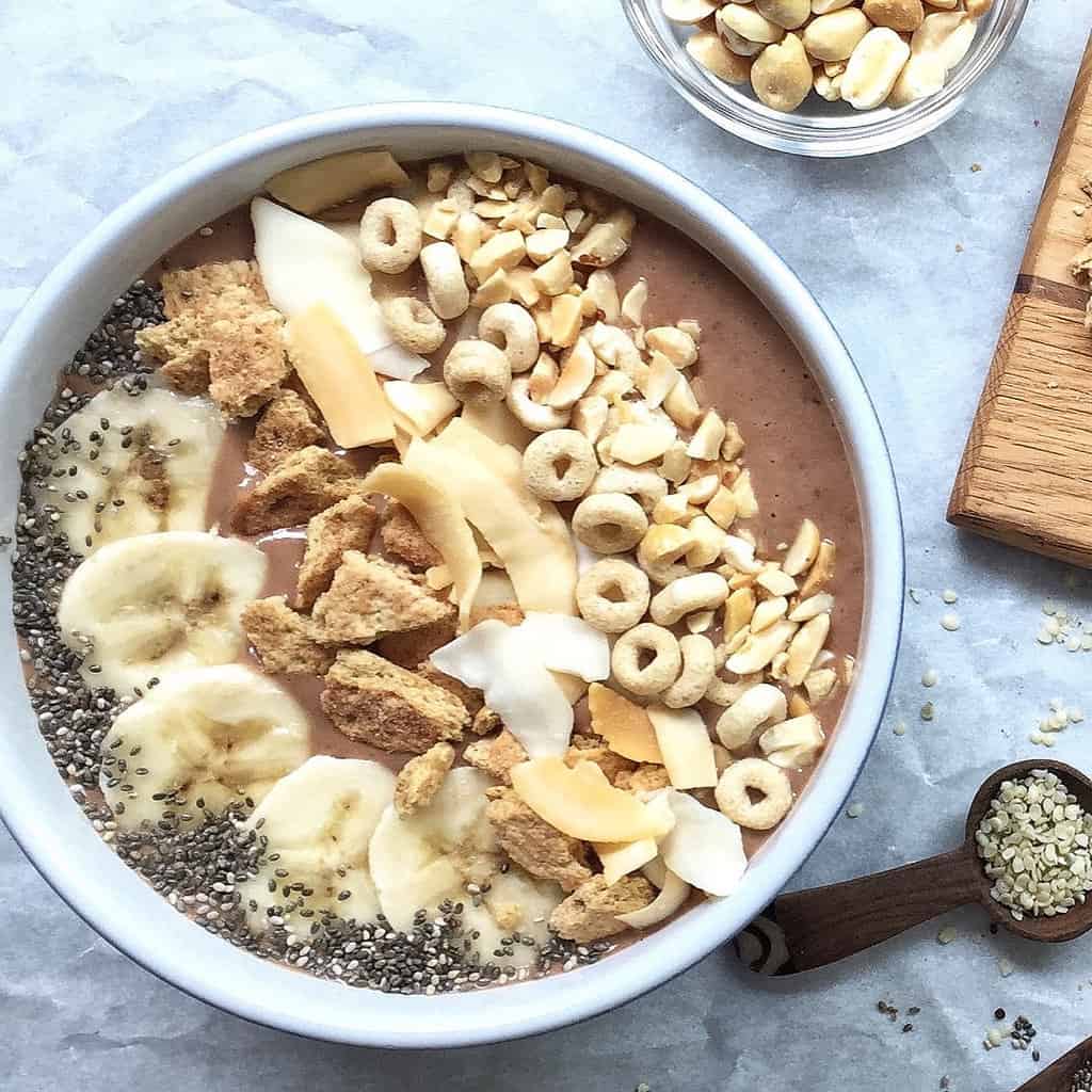 peanut butter banana smoothie bowl with toppings