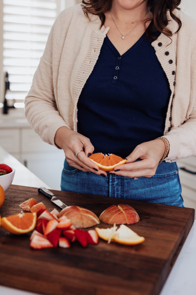 woman cutting oranges newly diagnosed diabetes