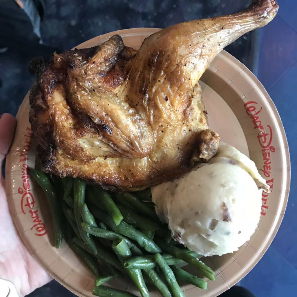 disney world meal at Tomorrow Land rotisserie chicken, mashed potatoes, and green beans
