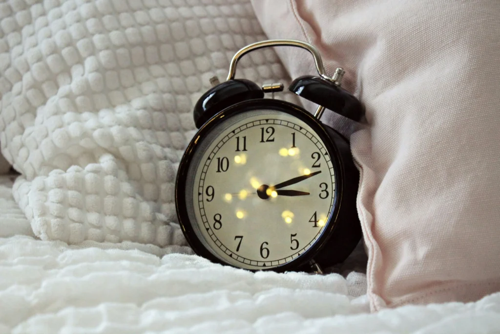diabetes and sleep alarm clock on bed