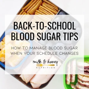 Hero image for a blog post showing a lunchbox with crackers, fruit, and sandwiches; bold overlay text reads 'BACK-TO-SCHOOL BLOOD SUGAR TIPS' with a subtitle below.