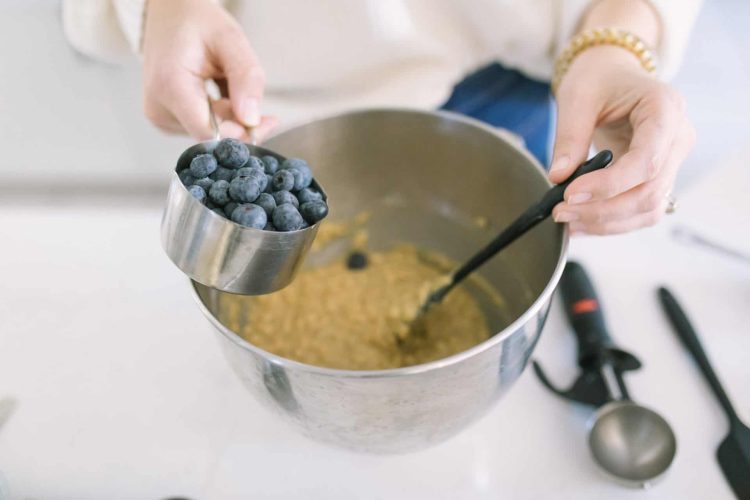 blueberries into bowl baking muffins
